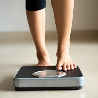 Person stepping on a scale