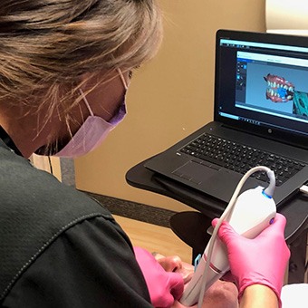 A patient having their mouth scanned for a custom oral appliance